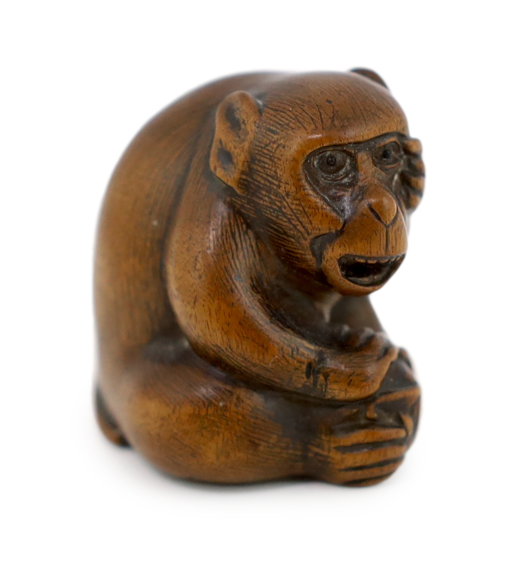 A Japanese carved wood netsuke of an ape, Tamba School, 19th century